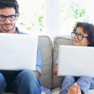 Father With Child At Computer